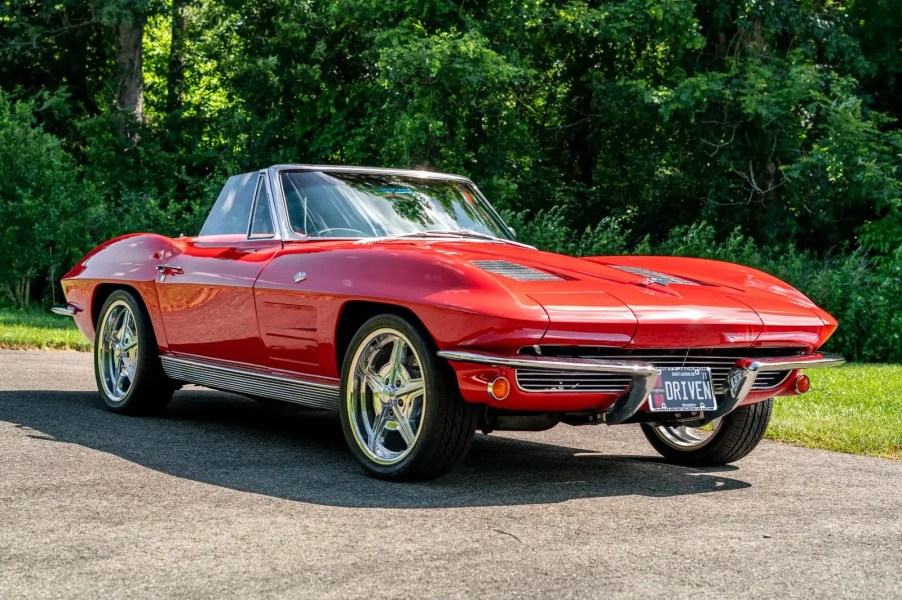 A red 1963 Chevrolet Corvette parked in right front angle view
