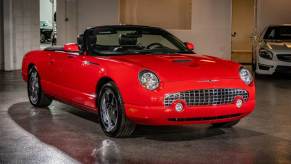 A red 2002 Ford Thunderbird parked in left front angle view
