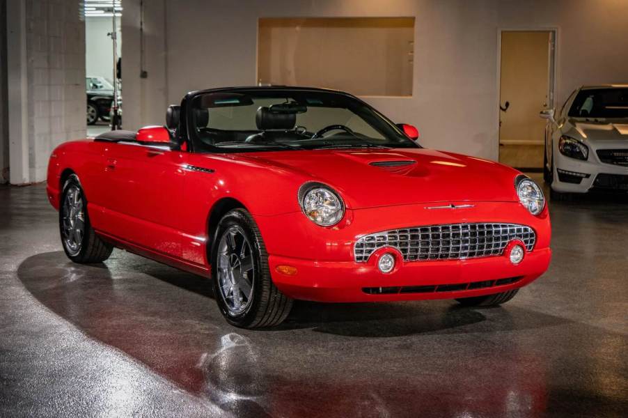 A red 2002 Ford Thunderbird parked in left front angle view