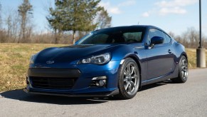 A blue 2013 Subaru BRZ parked in left front angle view