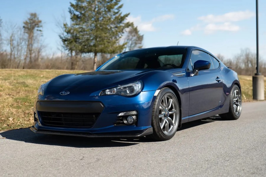 A blue 2013 Subaru BRZ parked in left front angle view