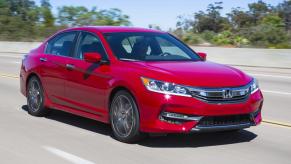 A red 2016 Honda Accord driving in right front angle view