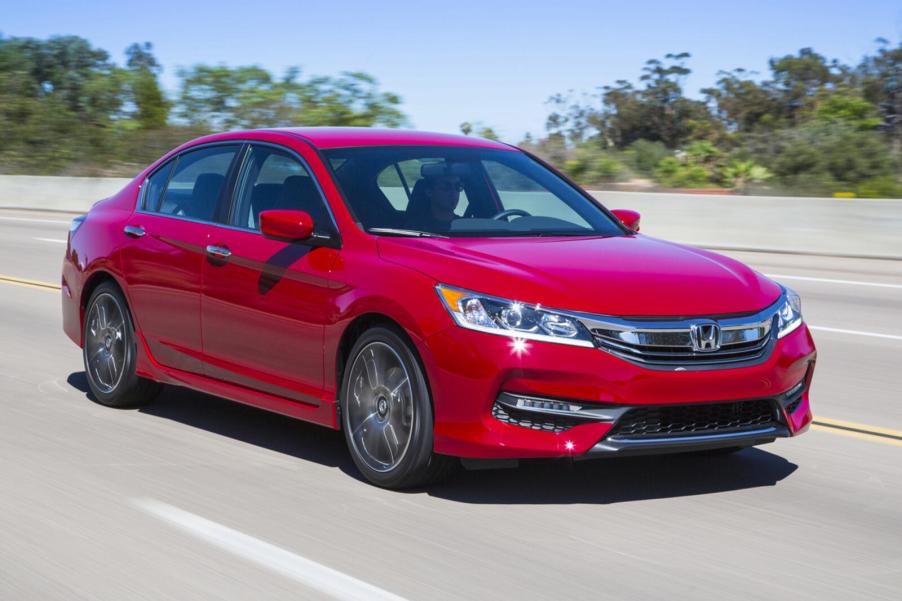 A red 2016 Honda Accord driving in right front angle view
