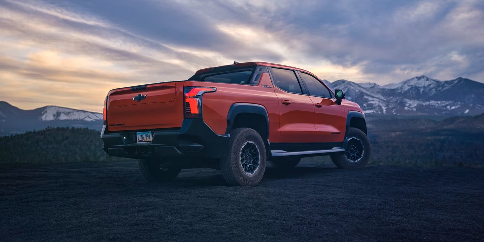 A 2026 Chevrolet Silverado EV, which just broke a range record, under an overcast sky.