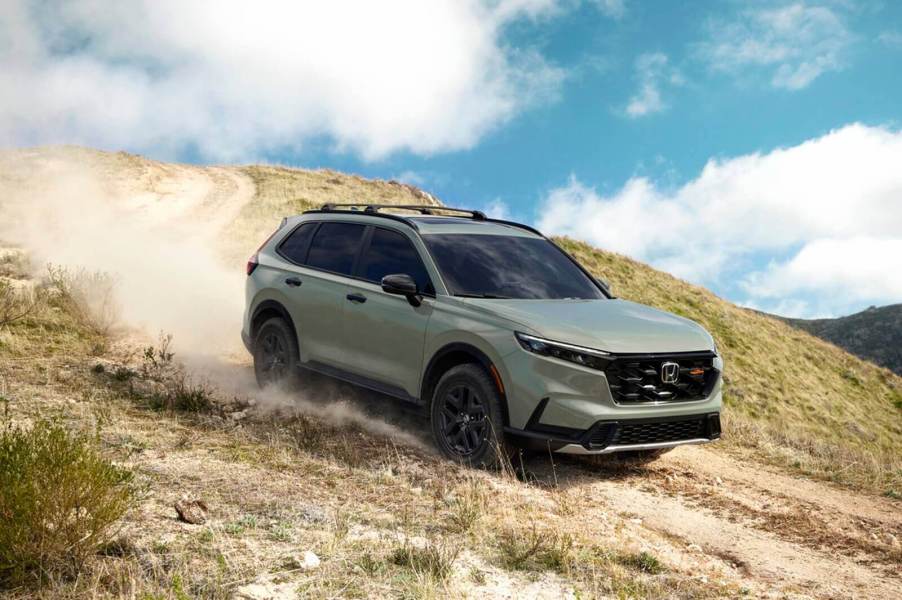 A 2026 Honda CR-V TrailSport drives down a hill.