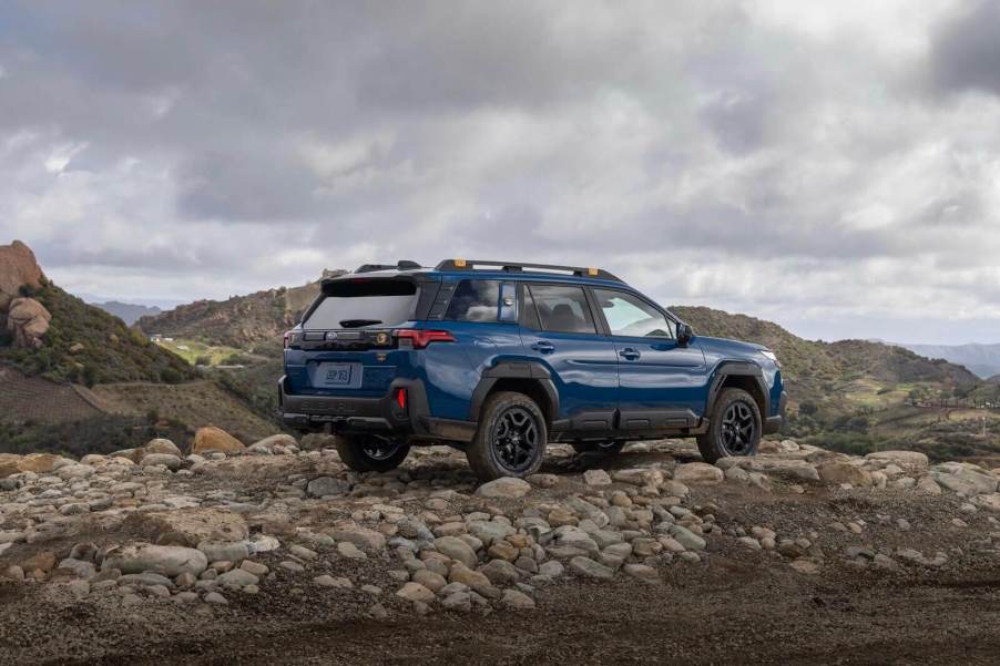 A 2026 Subaru Outback Wilderness on a rocky summit.
