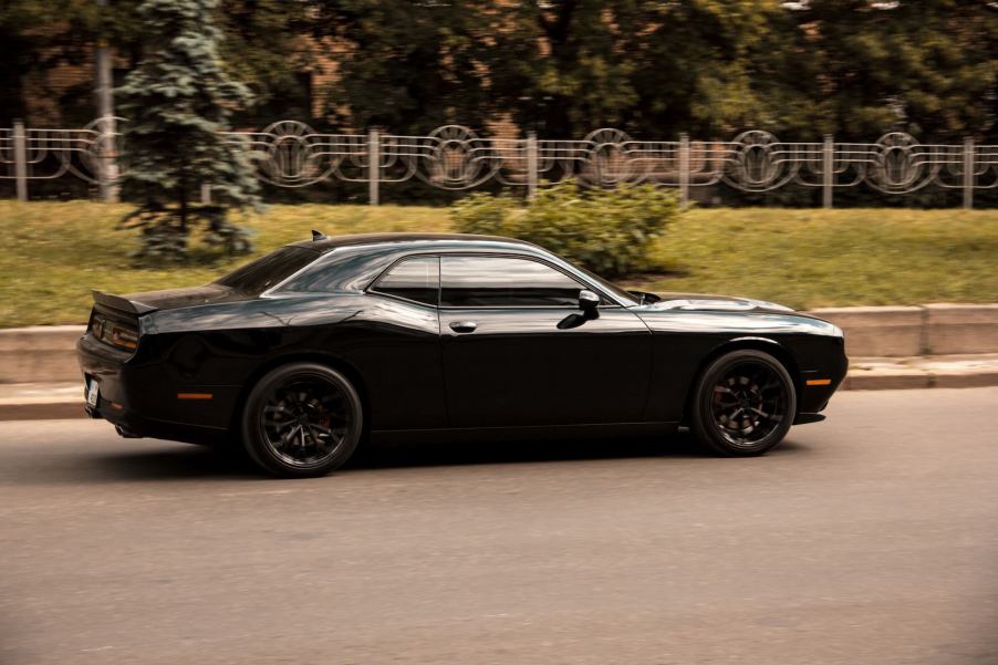 Black Dodge Challenger car that was stolen during a test drive in Georgia, racing down the street.