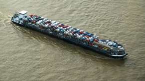 Car transport ship leaving the Port of Virginia, loaded with cargo.