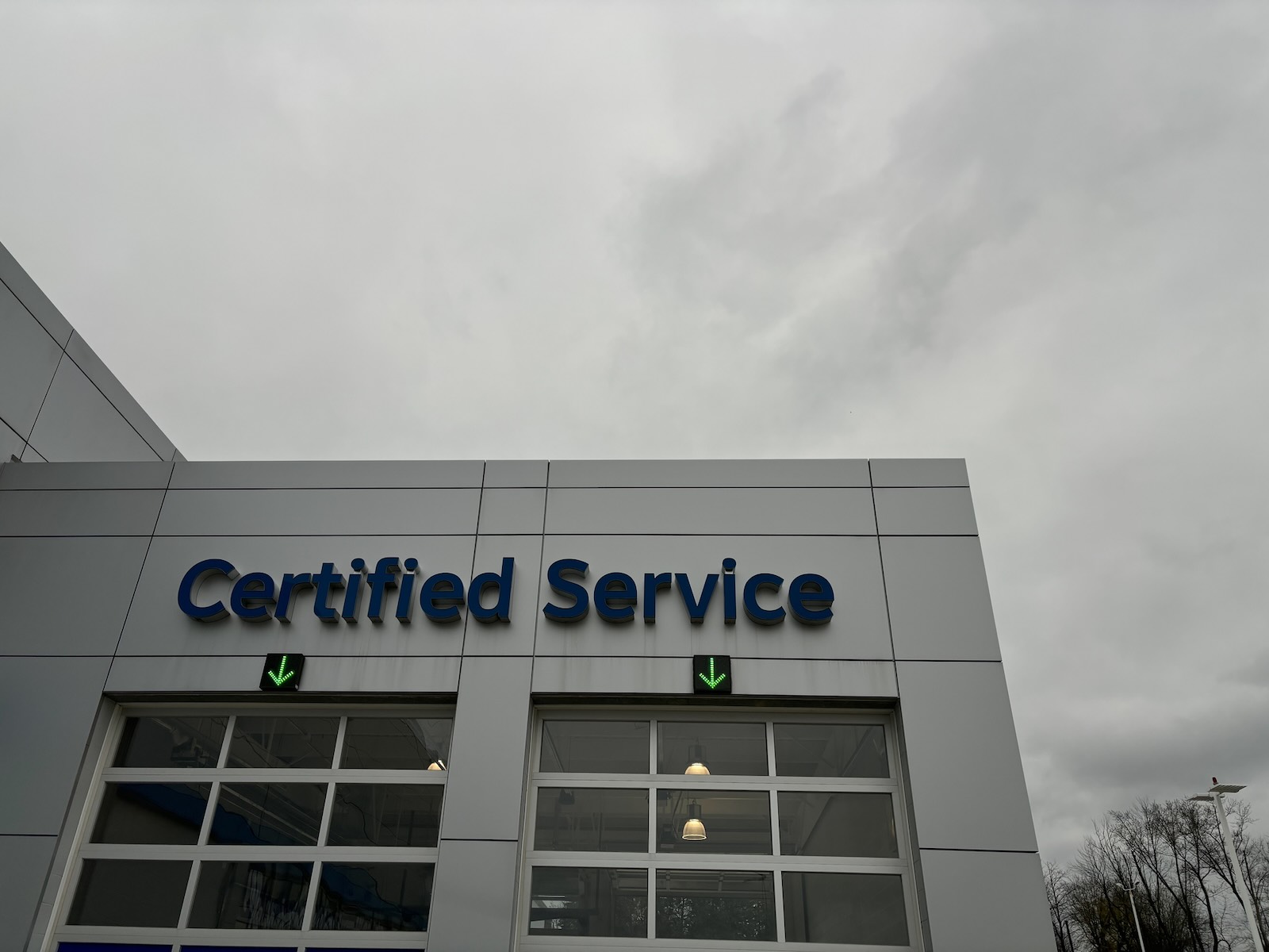 Certified service sign above the garage at a Jeep dealership
