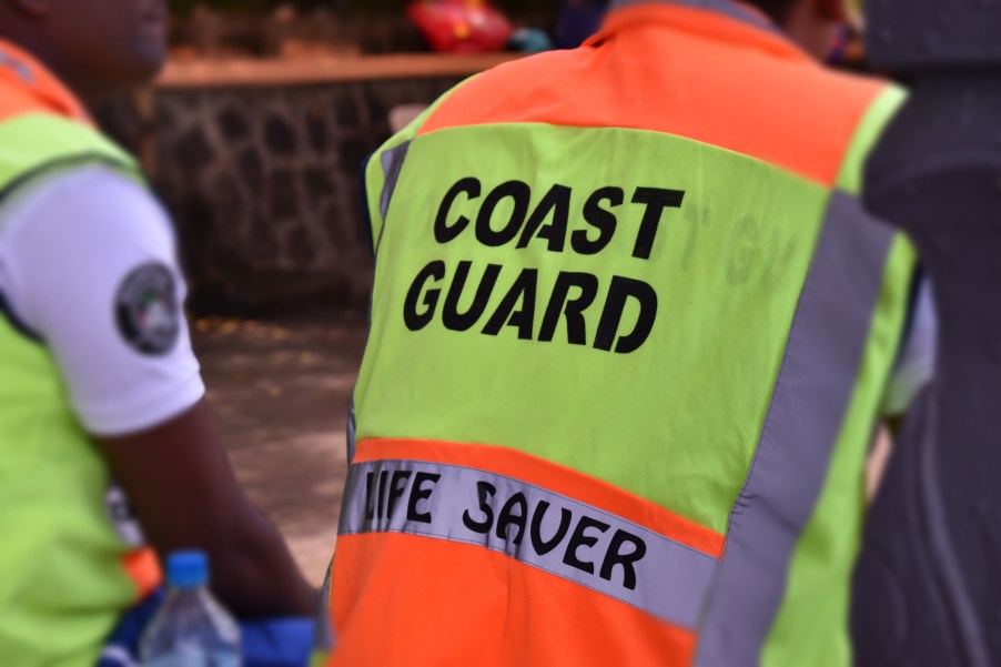 Coast Guard members near water