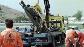 The remains of Martin Donnelly's yellow Lotus Formula 1 F1 car loaded onto a tow truck in 1990