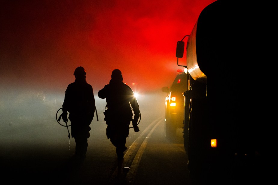 Firefighters on the road at night