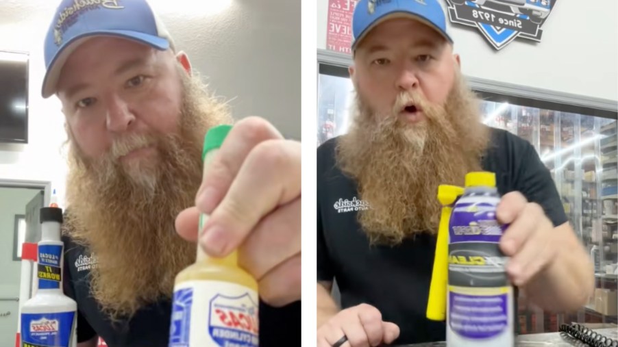 Auto parts expert holding fuel system cleaners