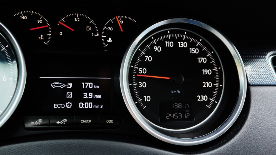 A set of gauges reveals information like tire pressure and gas mileage, which are connected factors of driving.