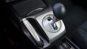 The gearshift lever in an automatic transmission car coasting downhill in neutral