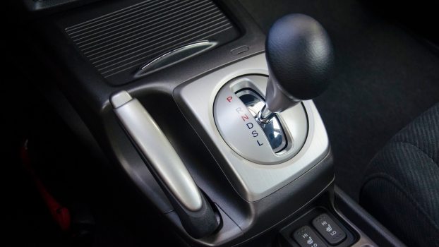 The gearshift lever in an automatic transmission car coasting downhill in neutral