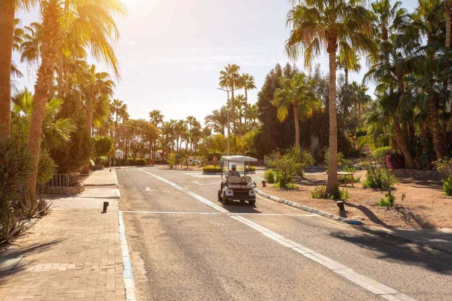 A golf cart cruising under the Florida sun.