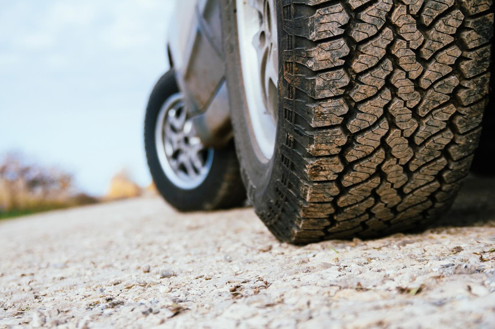 The tires of a Lexus GX luxury SUV parked off-road