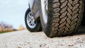 The tires of a Lexus GX luxury SUV parked off-road
