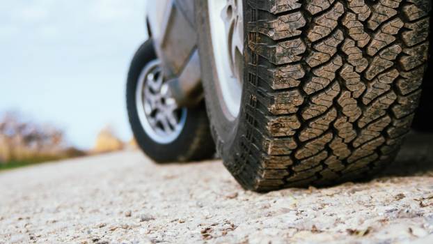 The tires of a Lexus GX luxury SUV parked off-road