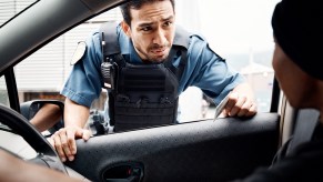 A police officer at a car window