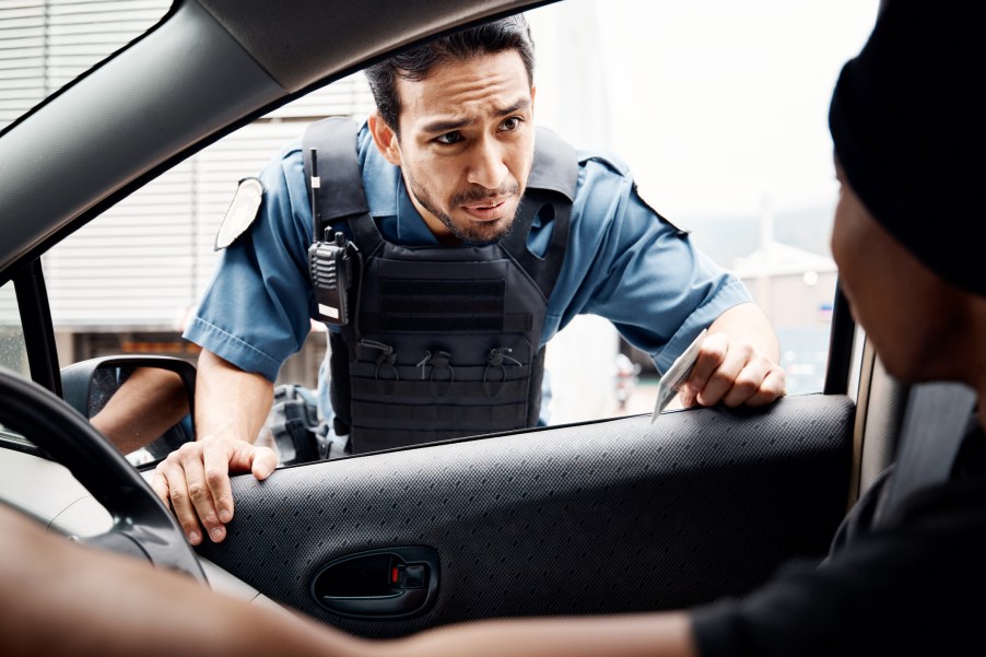 A police officer at a car window