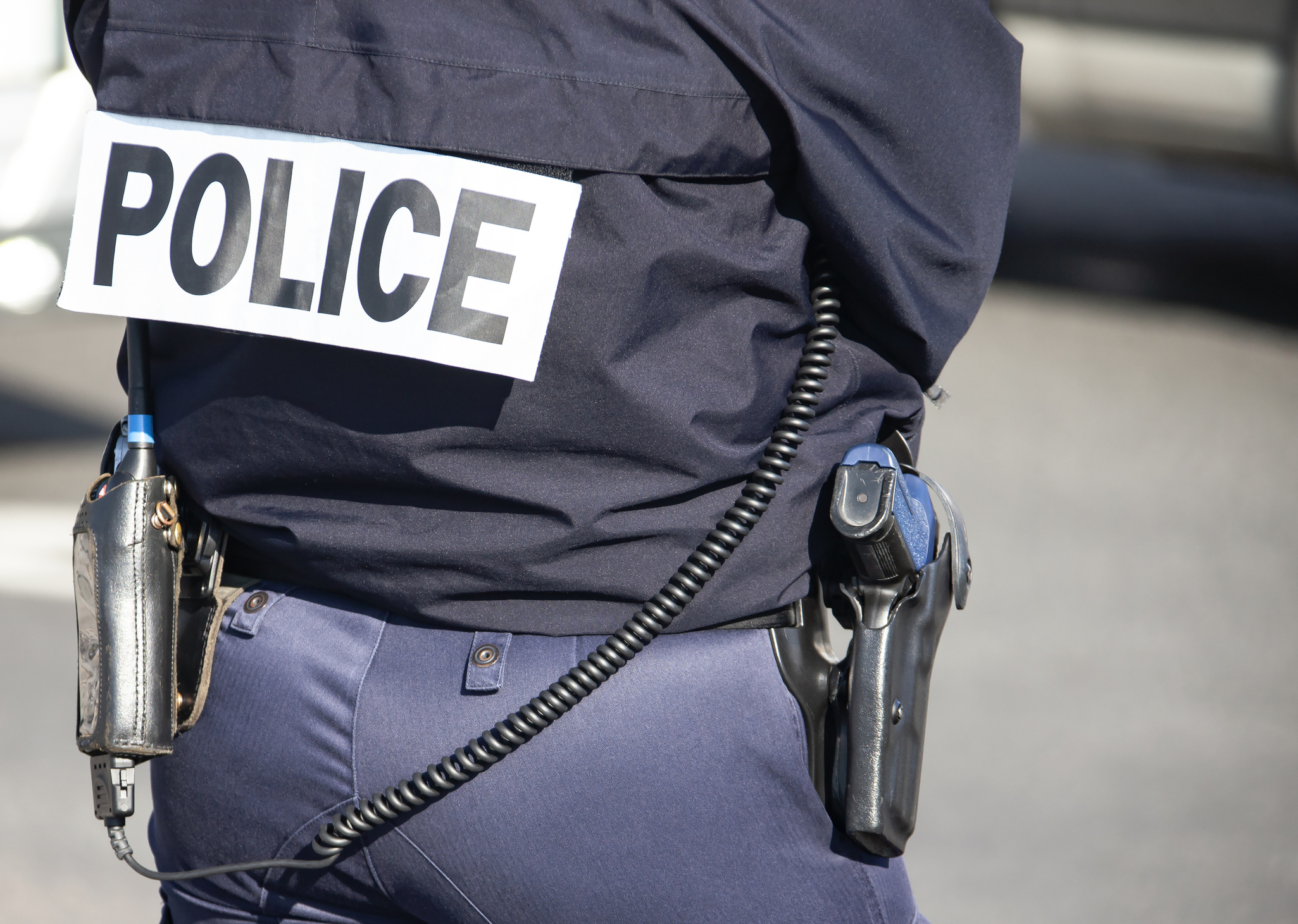 A police officer from behind