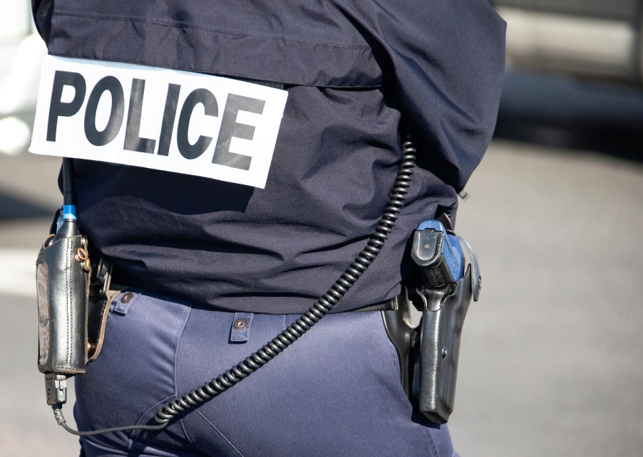 A police officer from behind