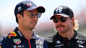Cadillac's two Formula 1 drivers stand together at the Hungarian Grand Prix