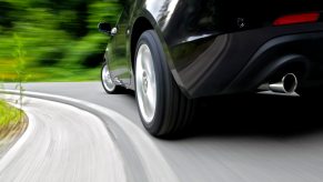 Closeup of the wheels of a speeding driver in Switzerland getting a ticket.
