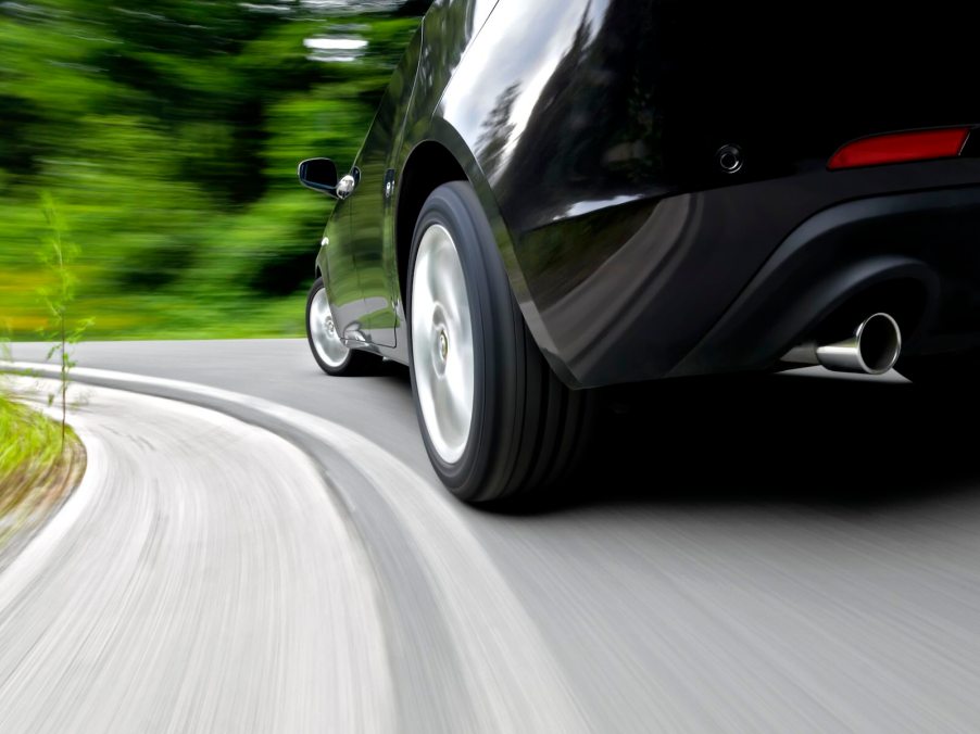 Closeup of the wheels of a speeding driver in Switzerland getting a ticket.