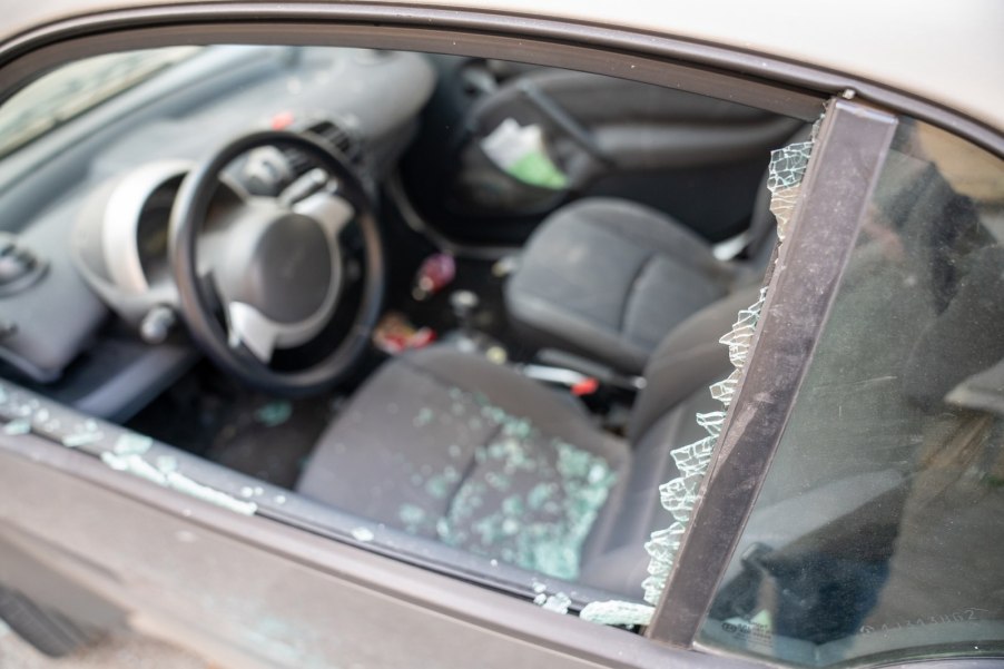 Parked car with broken window.