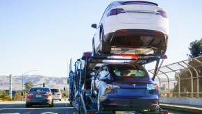 A Car Transporter with Tesla SUVs on the road