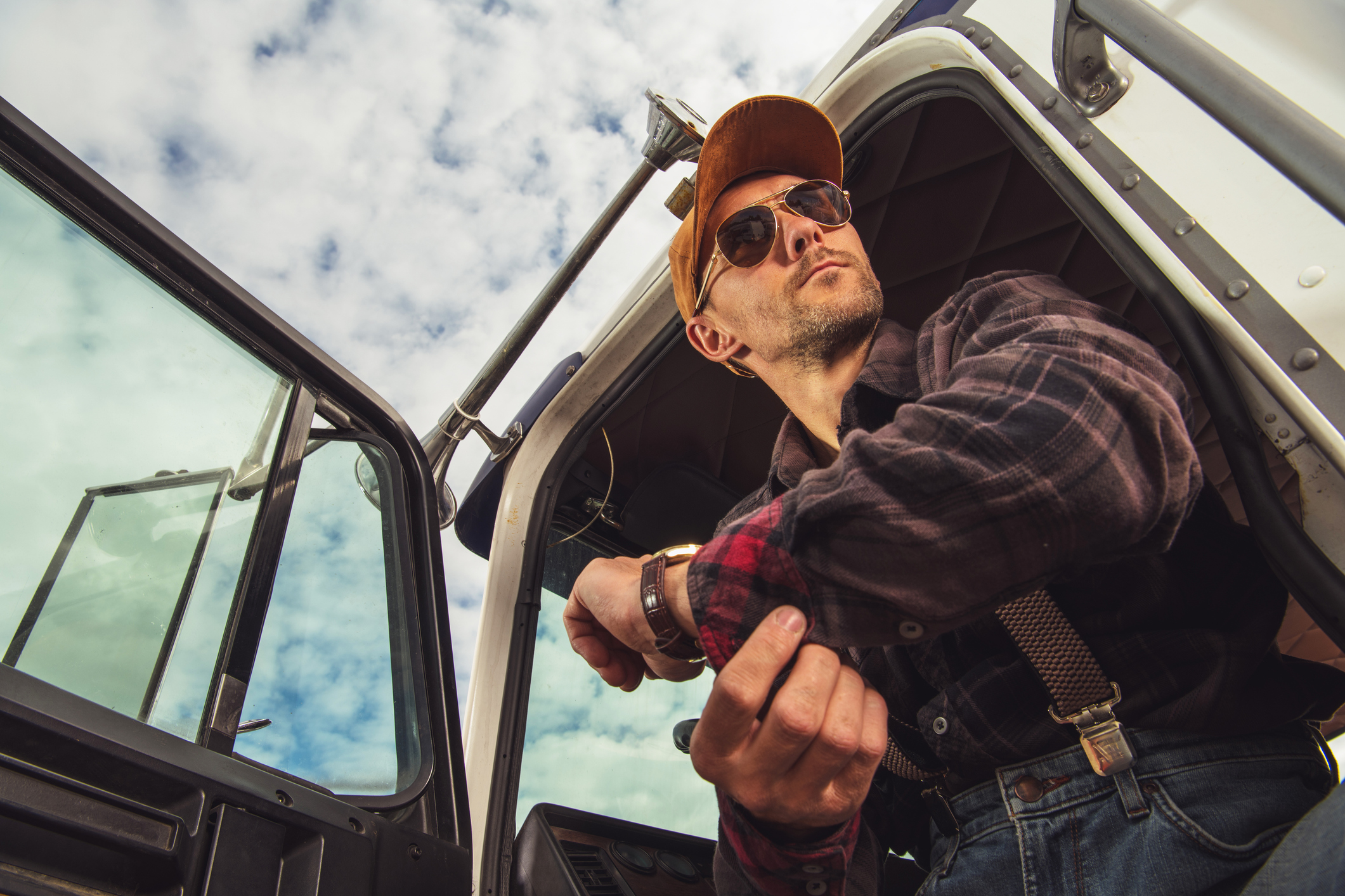 A trucker in a semi-truck