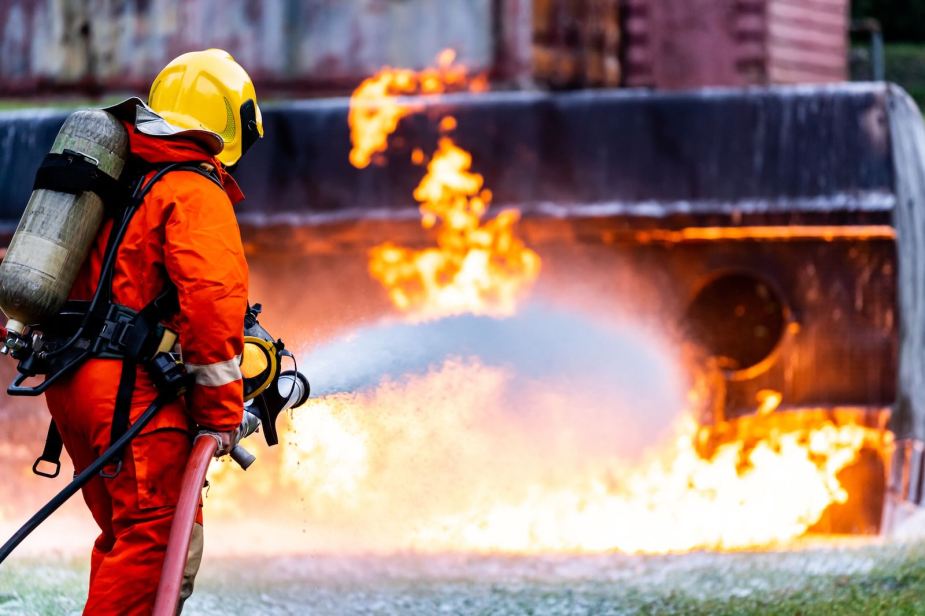 Vegan firefighter uses a hose to put out burning semi truck full of steaks