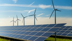 Wind turbines and solar panels on a farm