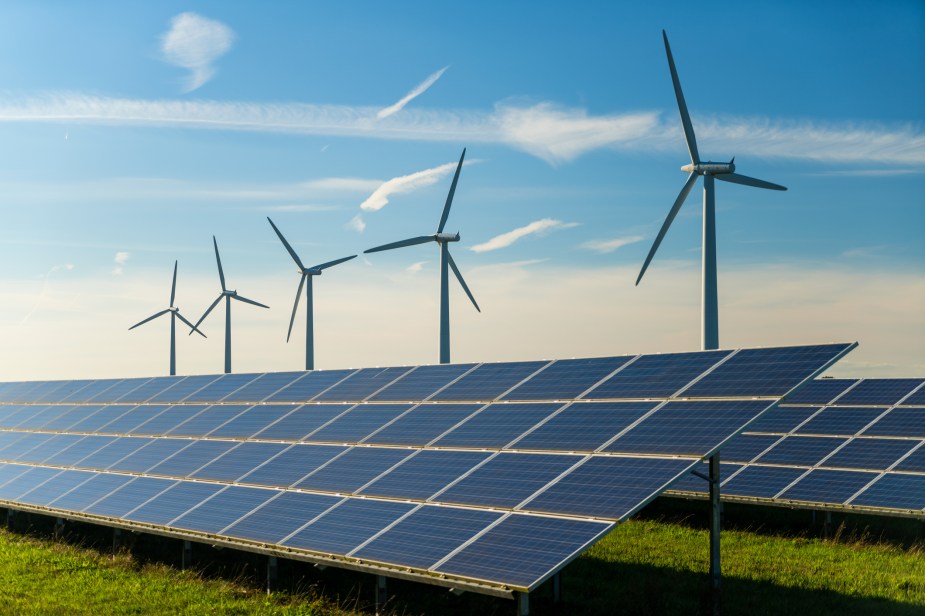 Wind turbines and solar panels on a farm