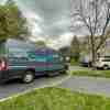 An Amazon Prime delivery van parked on a residential street in right side angle view