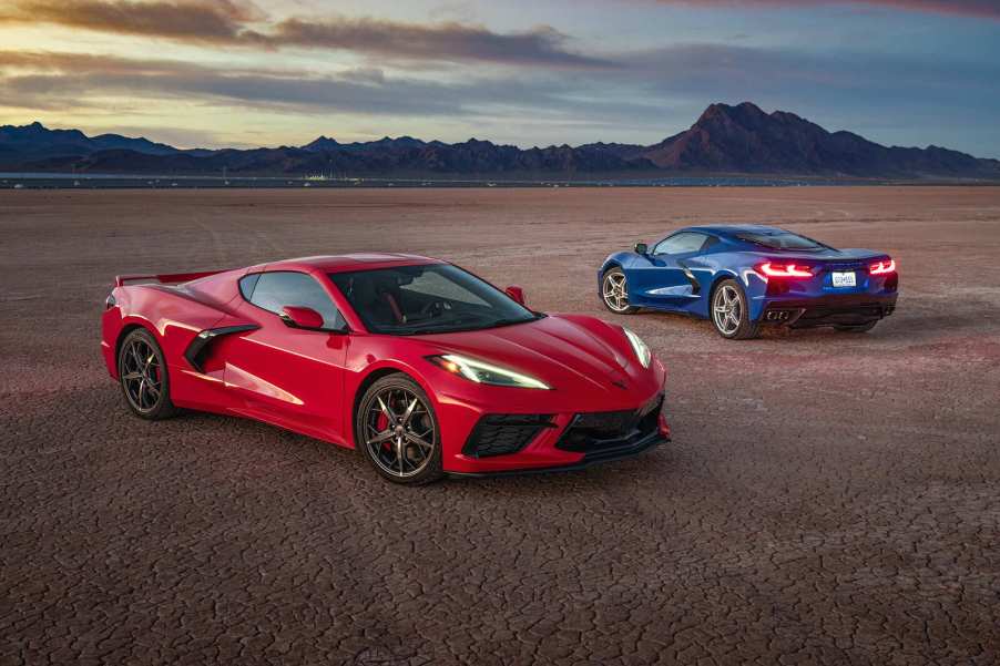 Two Chevrolet Corvette performance cars parked in the desert
