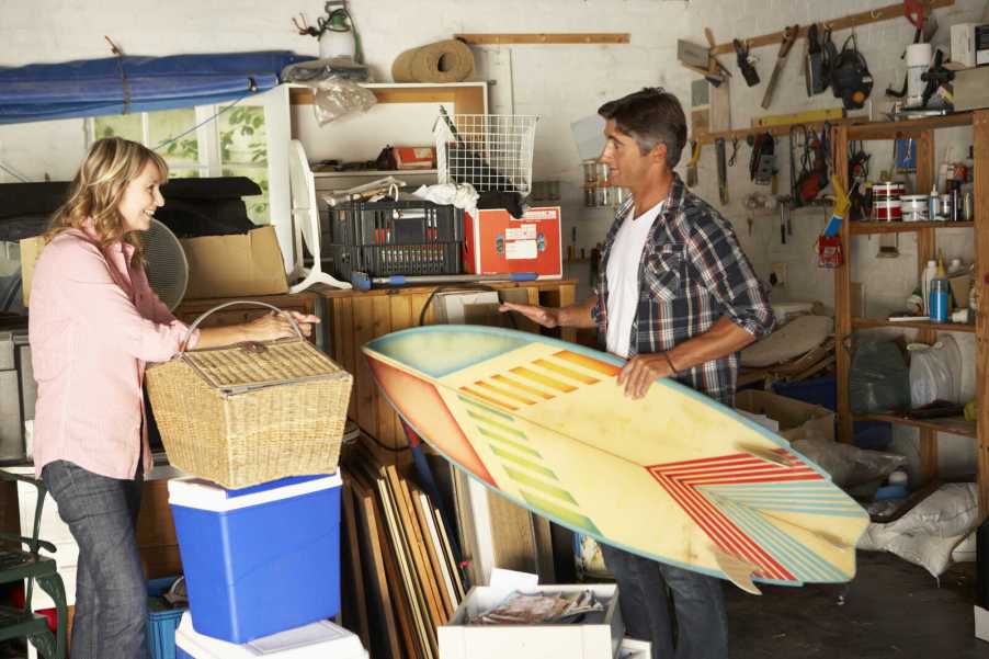 A couple cleans out their cluttered garage