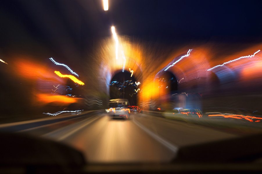 A blurred shot of driving at night from driver's perspective