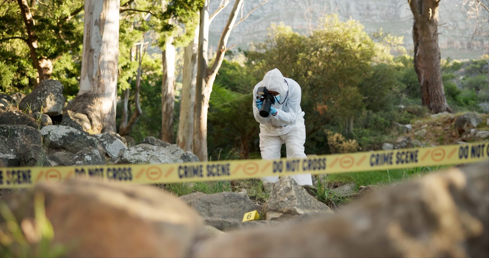 CSI police investigate hit-and-run body by roadside.