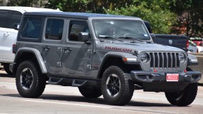 A charcoal Jeep Wrangler Rubicon in right front angle view
