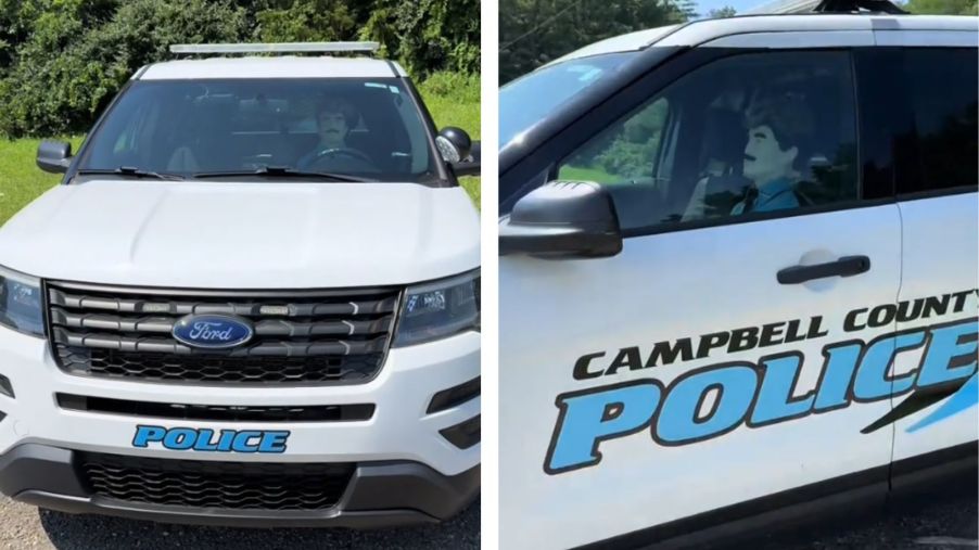 Police dummy inside a Kentucky police department SUV