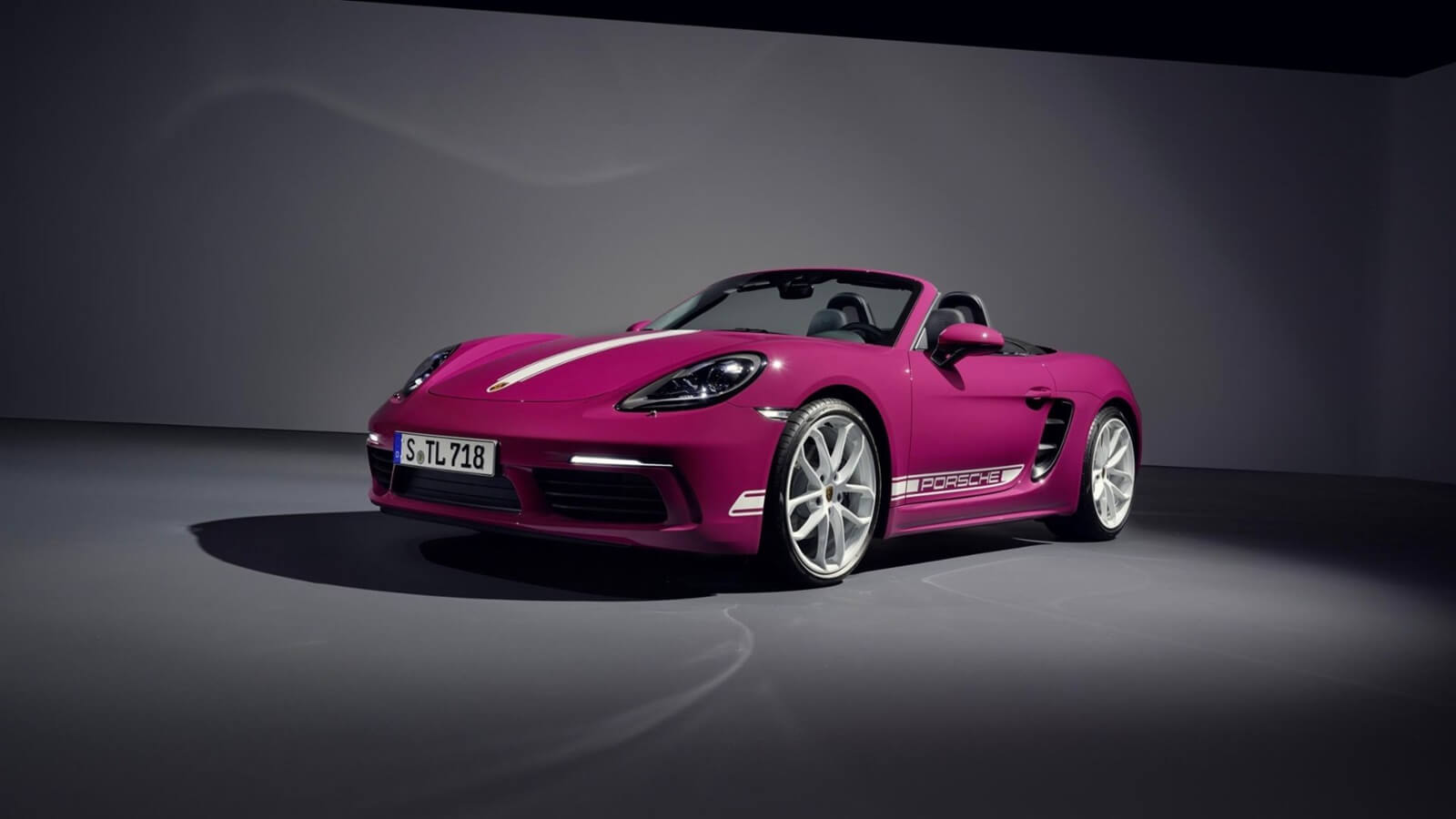 A Porsche 718 Boxster shows off its bright paint work. 