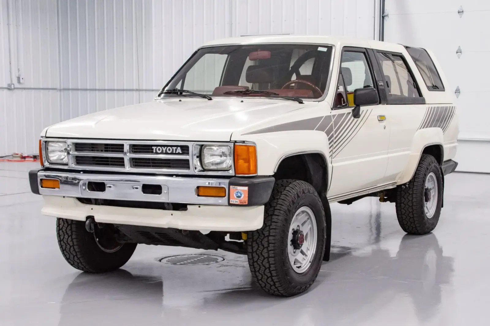 A white 1987 Toyota 4Runner parked in left front angle view