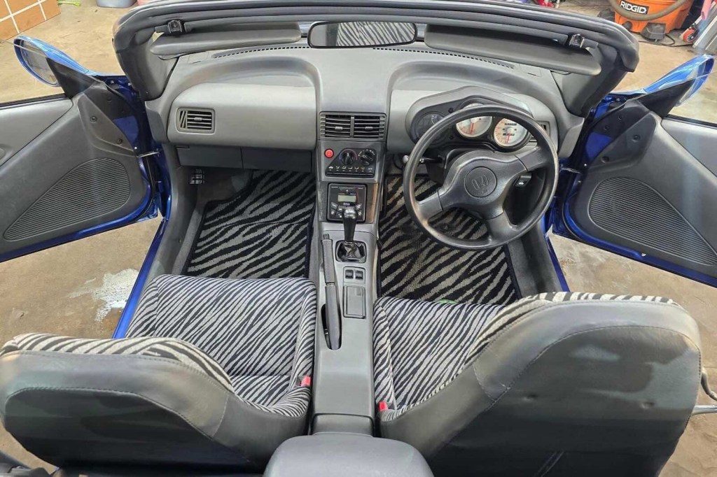 The Zebra print interior in a Honda Beat convertible sports car.