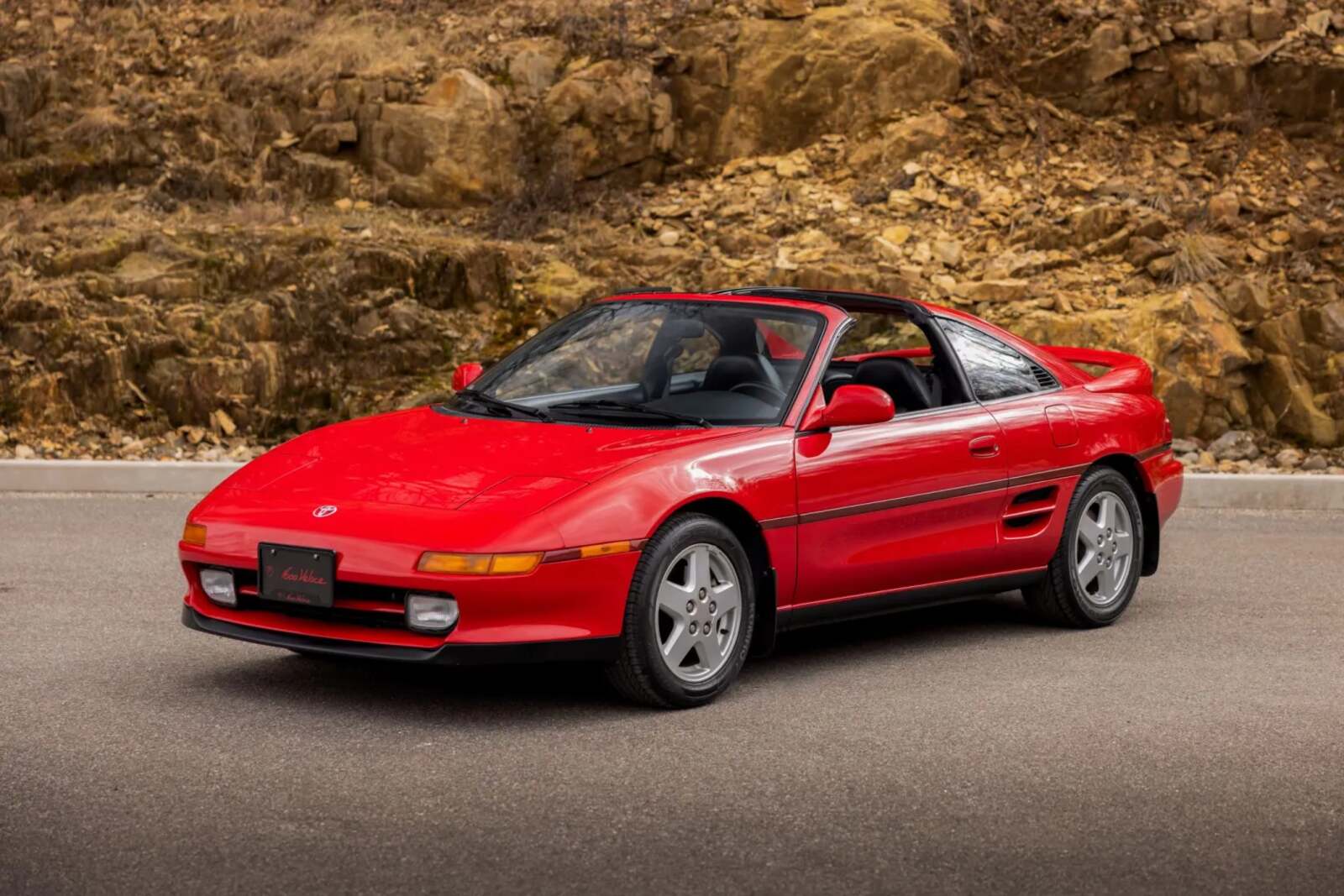 A red 1993 Toyota MR2 Turbo parked in left front angle view