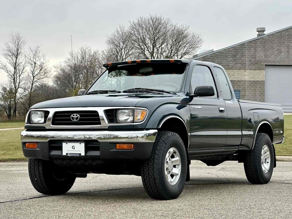 A dark-colored 1995 Toyota Tacoma parked in left front angle view