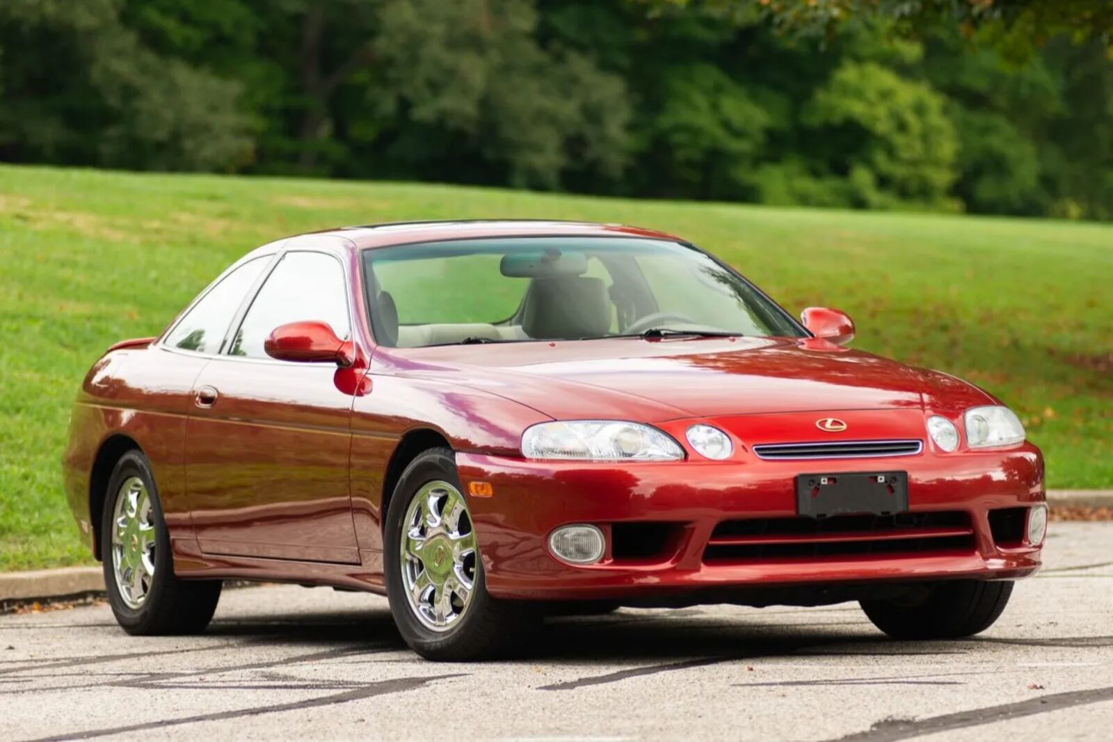 A red 2000 Lexus SC400 parked in right front angle view